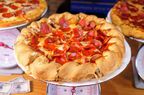 A pepperoni pizza with a mountainous crust from Beau Jo's.